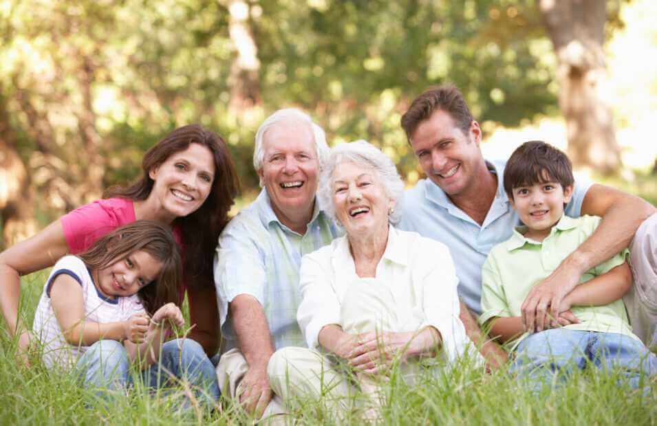 3 generation family smiling together