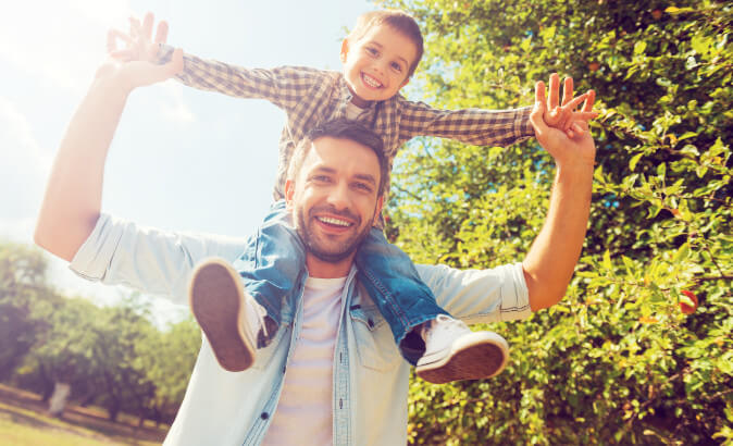 father and son smiling after dentist appointment