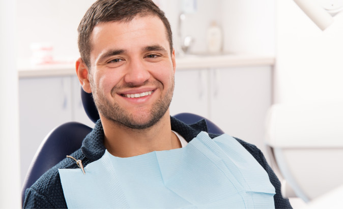patient sitting in dental chair