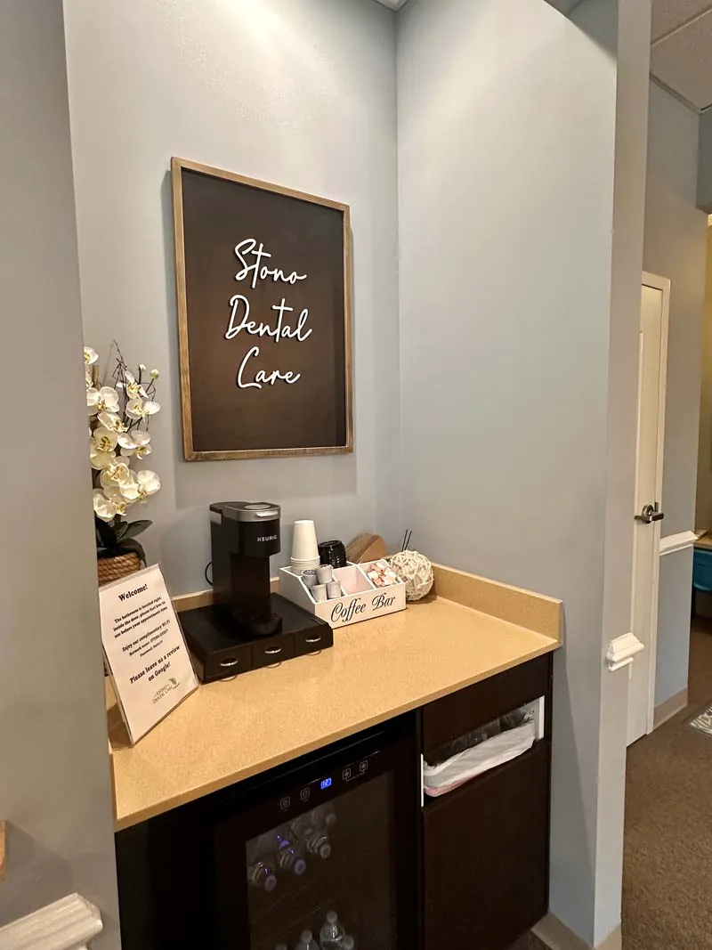 Stono Dental Care sign above office coffee bar