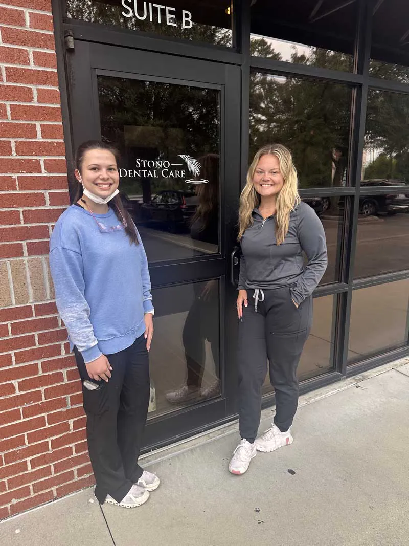staff standing outside front door of Stono Dental Care building
